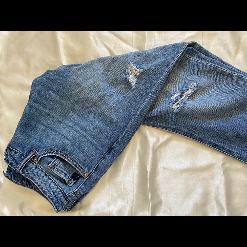 Distressed faux denim jeans